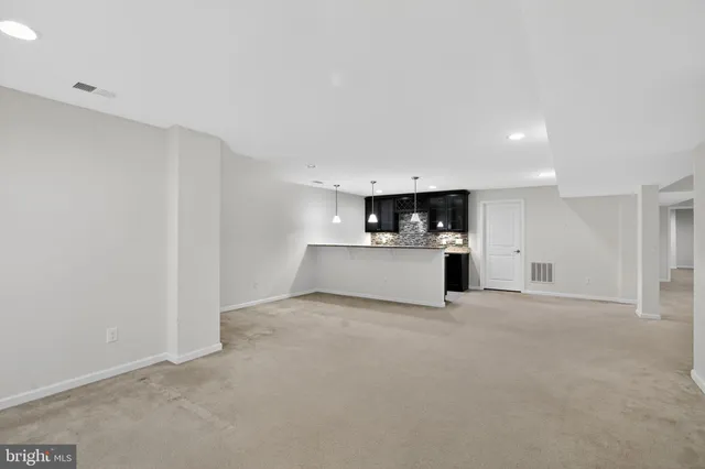 a view of a kitchen with a sink
