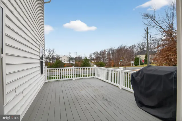 a front view of a house with a yard table and chairs