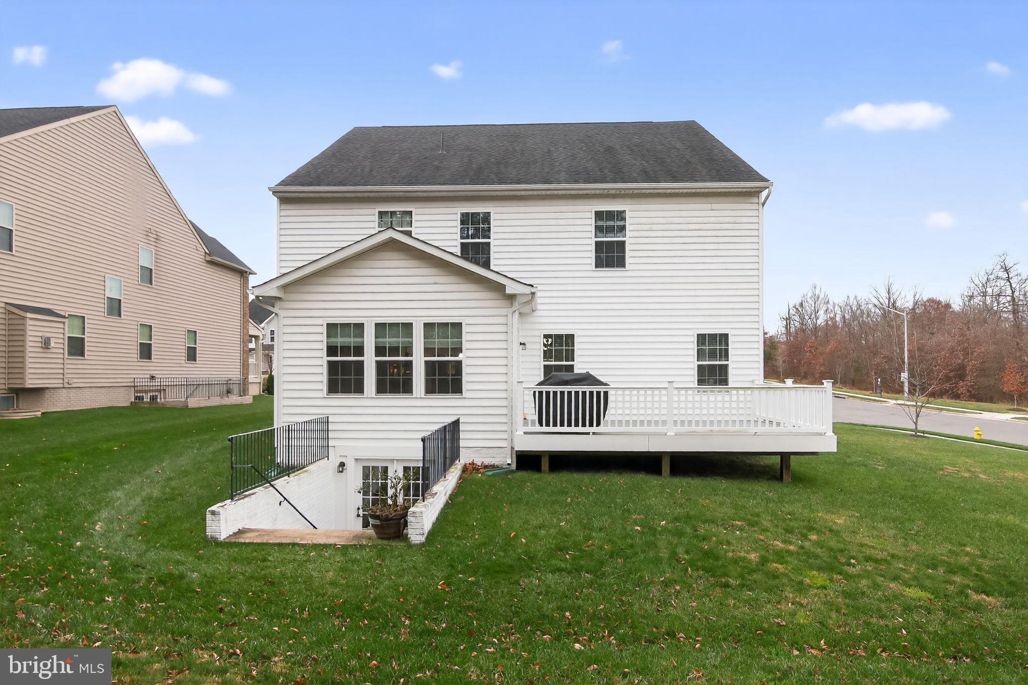 4401 Weejun Loop Woodbridge, VA 22192 - Photo 30 of 35 a front view of a house with a yard table and chairs