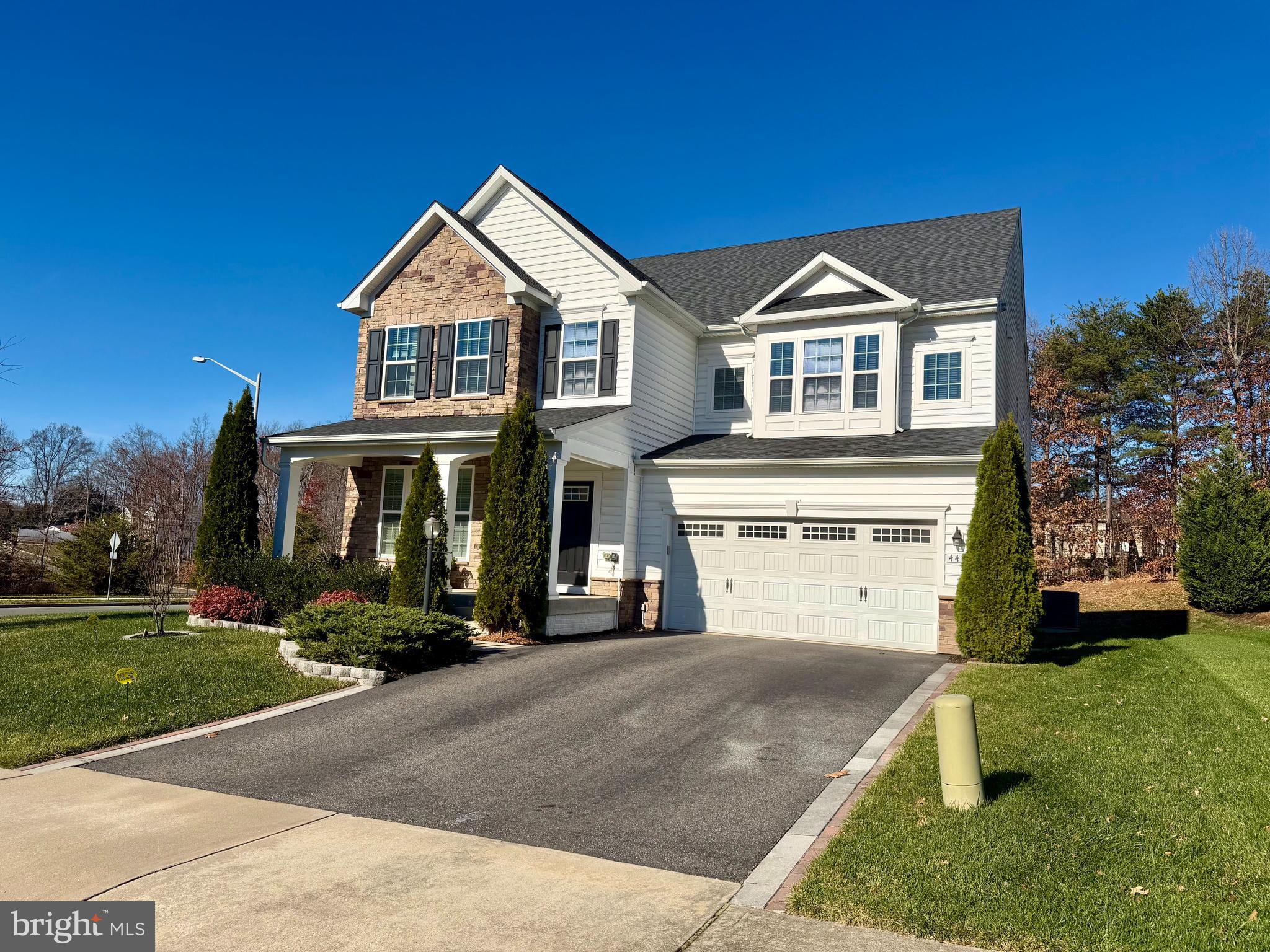 4401 Weejun Loop Woodbridge, VA 22192 - Photo 33 of 35 a front view of a house with a yard
