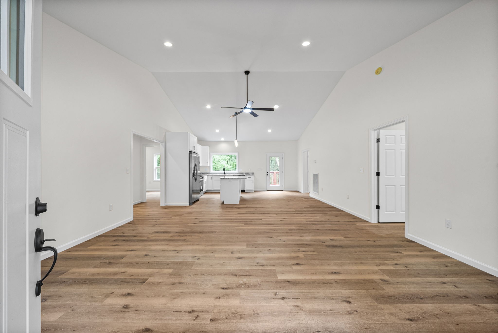 690 Brazzle Road Waverly, TN 37185 - Photo 6 of 35 a large room with chandelier fan and windows