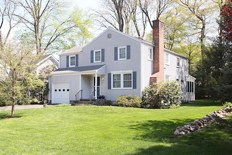 3 Miles Road Darien, CT 06820 - Photo 1 of 32 a front view of a house with a yard and trees