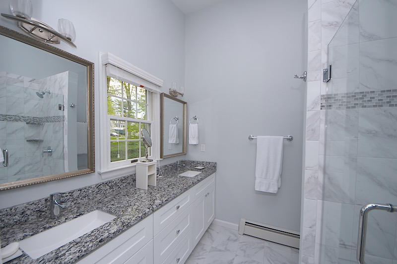 3 Miles Road Darien, CT 06820 - Photo 14 of 32 a bathroom with a granite countertop sink and a granite countertop shower