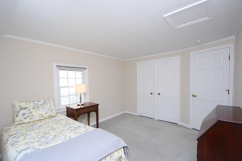 3 Miles Road Darien, CT 06820 - Photo 17 of 32 a bedroom with a bed and a window