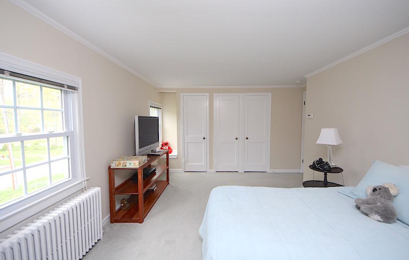 3 Miles Road Darien, CT 06820 - Photo 19 of 32 a bed room with a bed and a tv