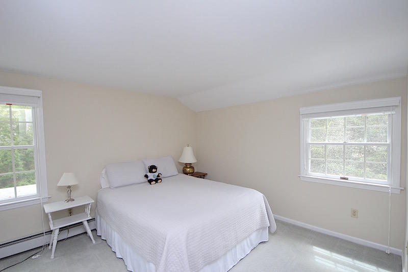 3 Miles Road Darien, CT 06820 - Photo 20 of 32 a bedroom with a bed and window