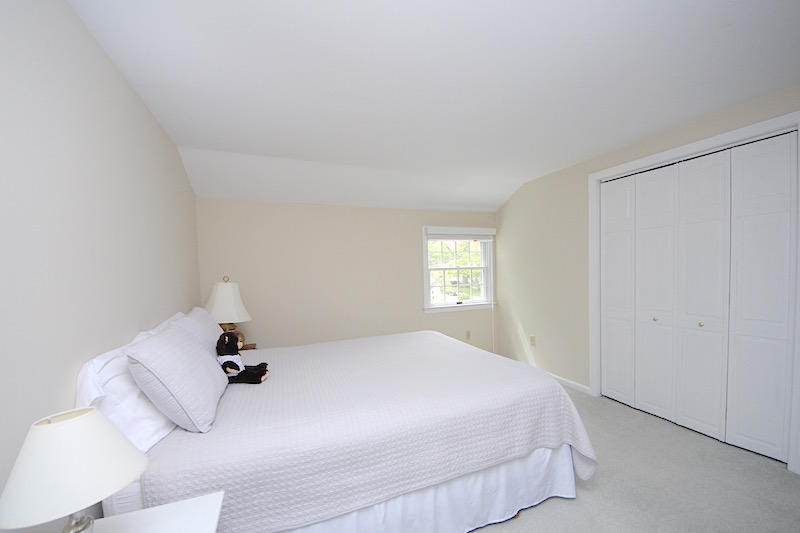 3 Miles Road Darien, CT 06820 - Photo 21 of 32 a bedroom with a bed and window