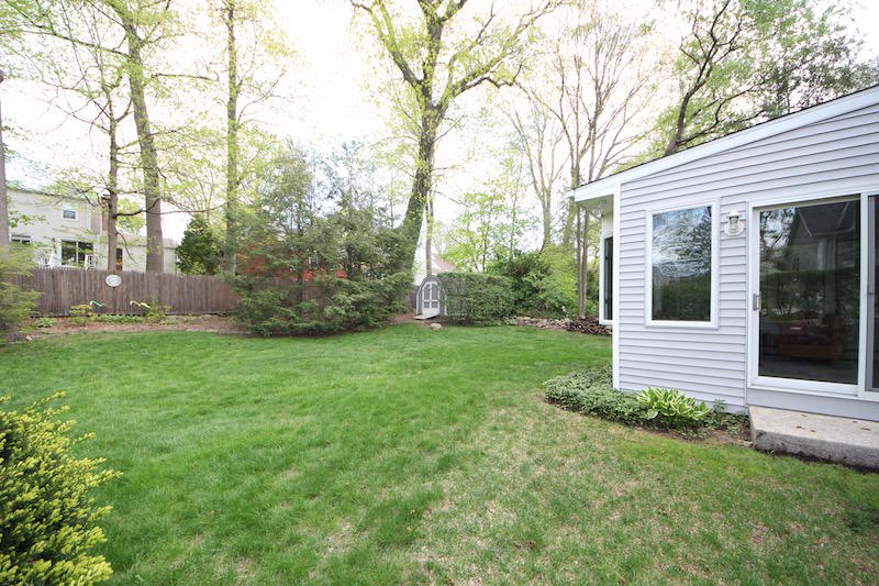 3 Miles Road Darien, CT 06820 - Photo 26 of 32 a view of a house with backyard and garden
