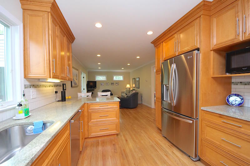 3 Miles Road Darien, CT 06820 - Photo 7 of 32 a kitchen with stainless steel appliances a refrigerator sink and wooden floor