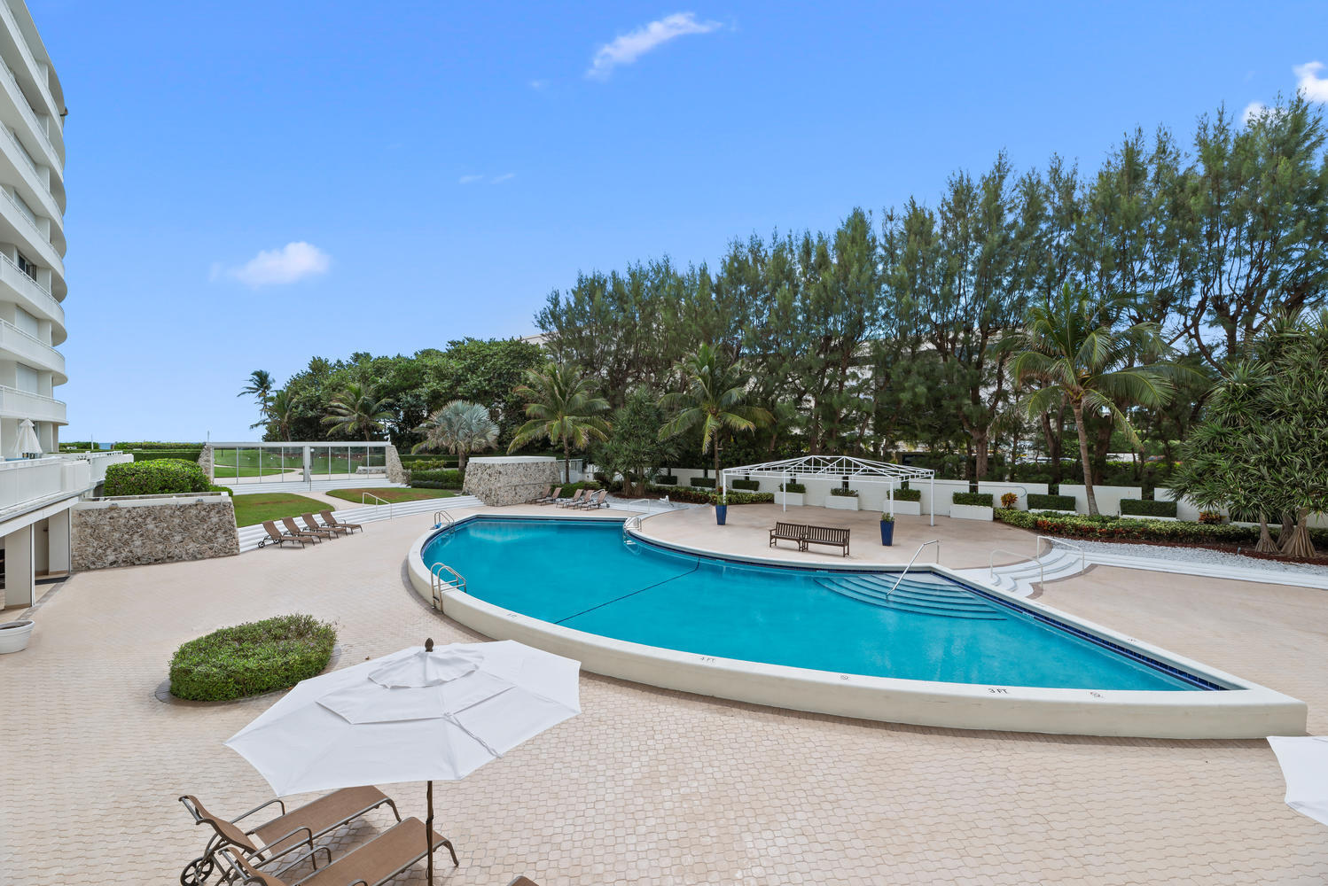 2780 South Ocean Boulevard, Unit 612 Palm Beach, FL 33480 - Photo 1 of 57 a view of a swimming pool with lounge chairs