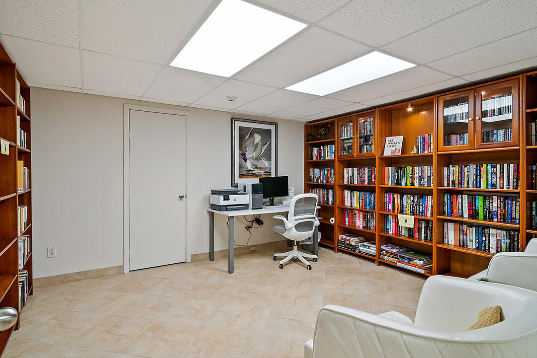 2780 South Ocean Boulevard, Unit 612 Palm Beach, FL 33480 - Photo 13 of 57 a view of a livingroom with workspace and a window