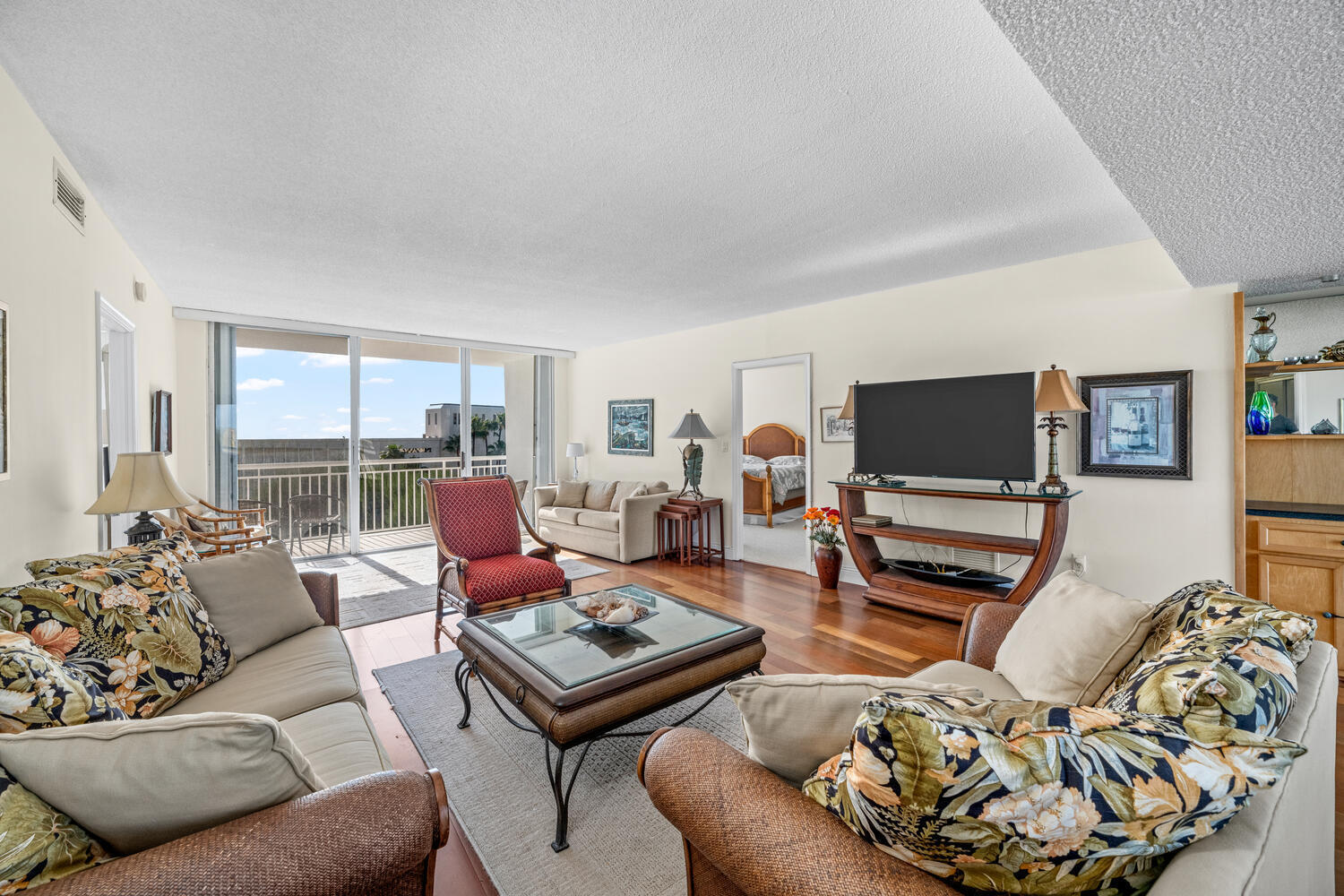 2780 South Ocean Boulevard, Unit 612 Palm Beach, FL 33480 - Photo 21 of 57 a living room with furniture and a flat screen tv