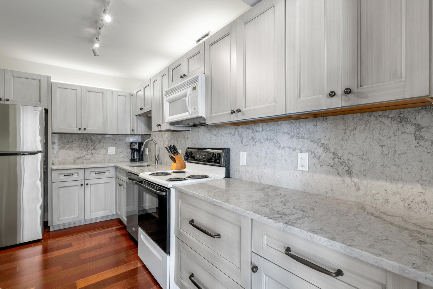2780 South Ocean Boulevard, Unit 612 Palm Beach, FL 33480 - Photo 22 of 57 a kitchen with stainless steel appliances granite countertop a sink stove and refrigerator