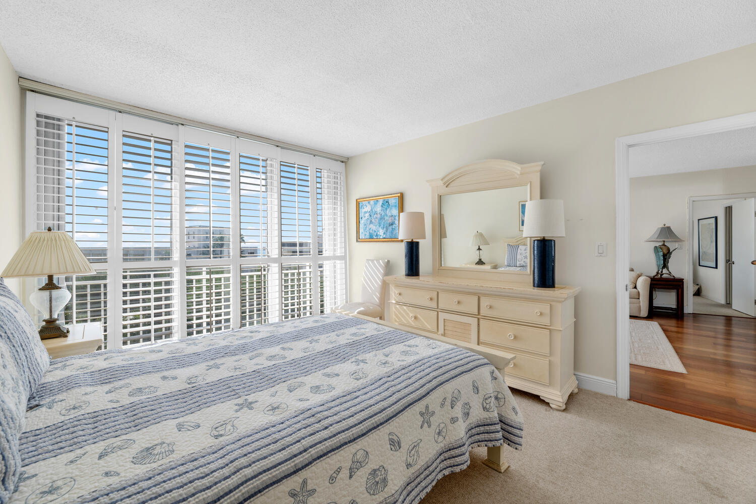 2780 South Ocean Boulevard, Unit 612 Palm Beach, FL 33480 - Photo 32 of 57 a bedroom with a large bed and a large window
