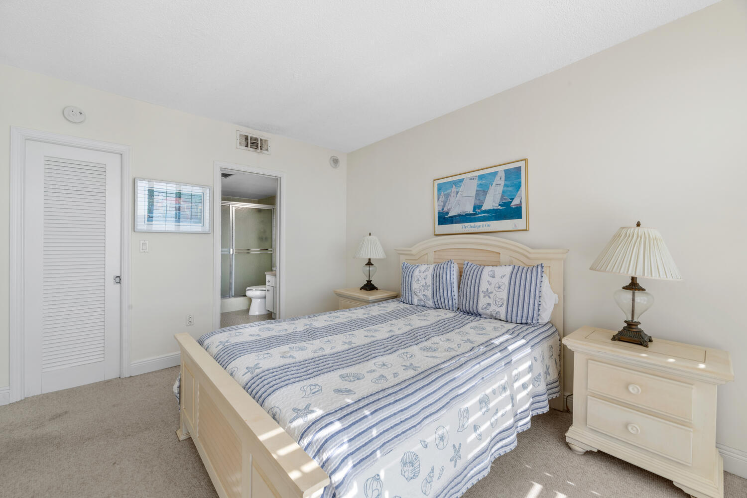 2780 South Ocean Boulevard, Unit 612 Palm Beach, FL 33480 - Photo 33 of 57 a bedroom with a bed and a chandelier