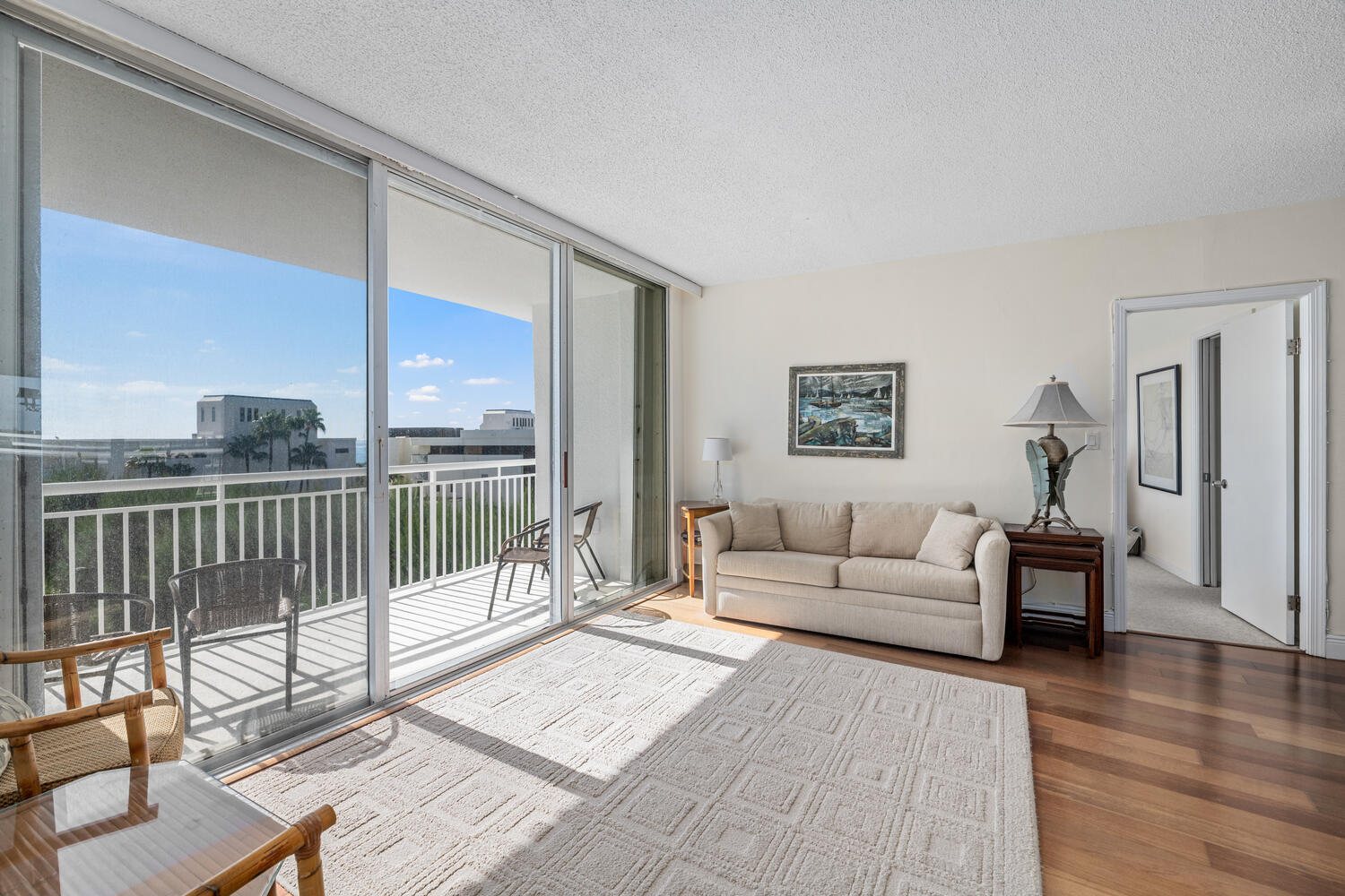 2780 South Ocean Boulevard, Unit 612 Palm Beach, FL 33480 - Photo 35 of 57 a living room with furniture and a floor to ceiling window