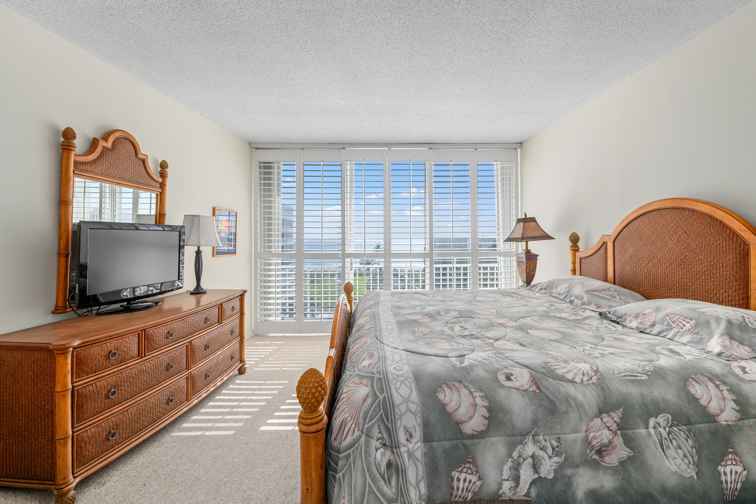 2780 South Ocean Boulevard, Unit 612 Palm Beach, FL 33480 - Photo 38 of 57 a bedroom with a bed and a flat screen tv