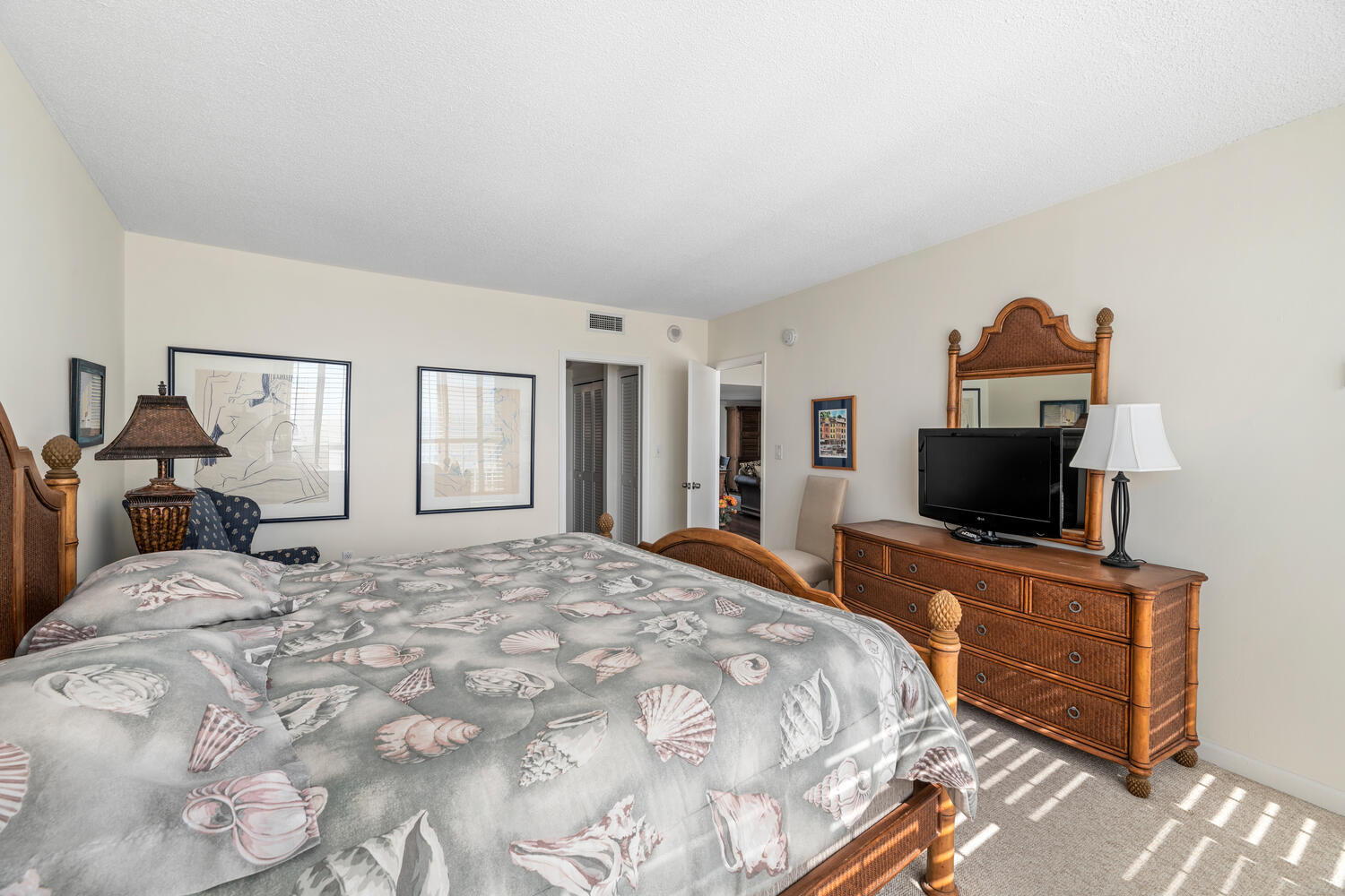 2780 South Ocean Boulevard, Unit 612 Palm Beach, FL 33480 - Photo 40 of 57 a bedroom with a bed and a flat screen tv