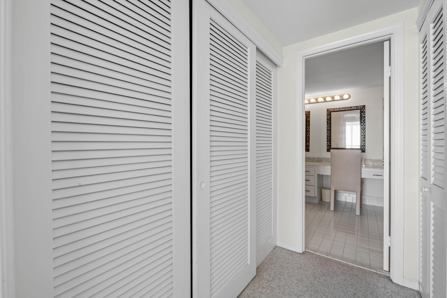 2780 South Ocean Boulevard, Unit 612 Palm Beach, FL 33480 - Photo 42 of 57 a view of a hallway with a table and chairs