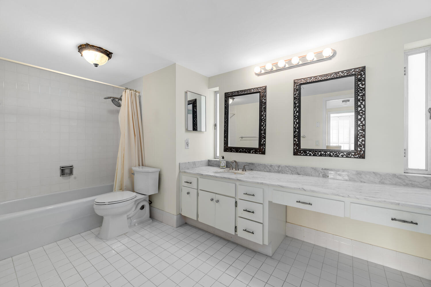 2780 South Ocean Boulevard, Unit 612 Palm Beach, FL 33480 - Photo 43 of 57 a bathroom with a double vanity sink toilet mirror and bathtub