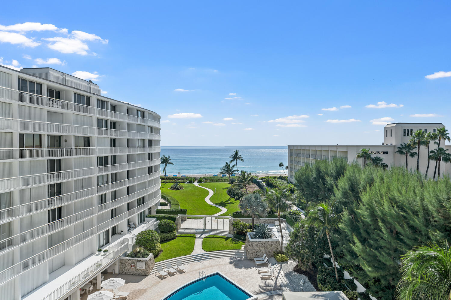 2780 South Ocean Boulevard, Unit 612 Palm Beach, FL 33480 - Photo 49 of 57 a view of a tall building in the backyard