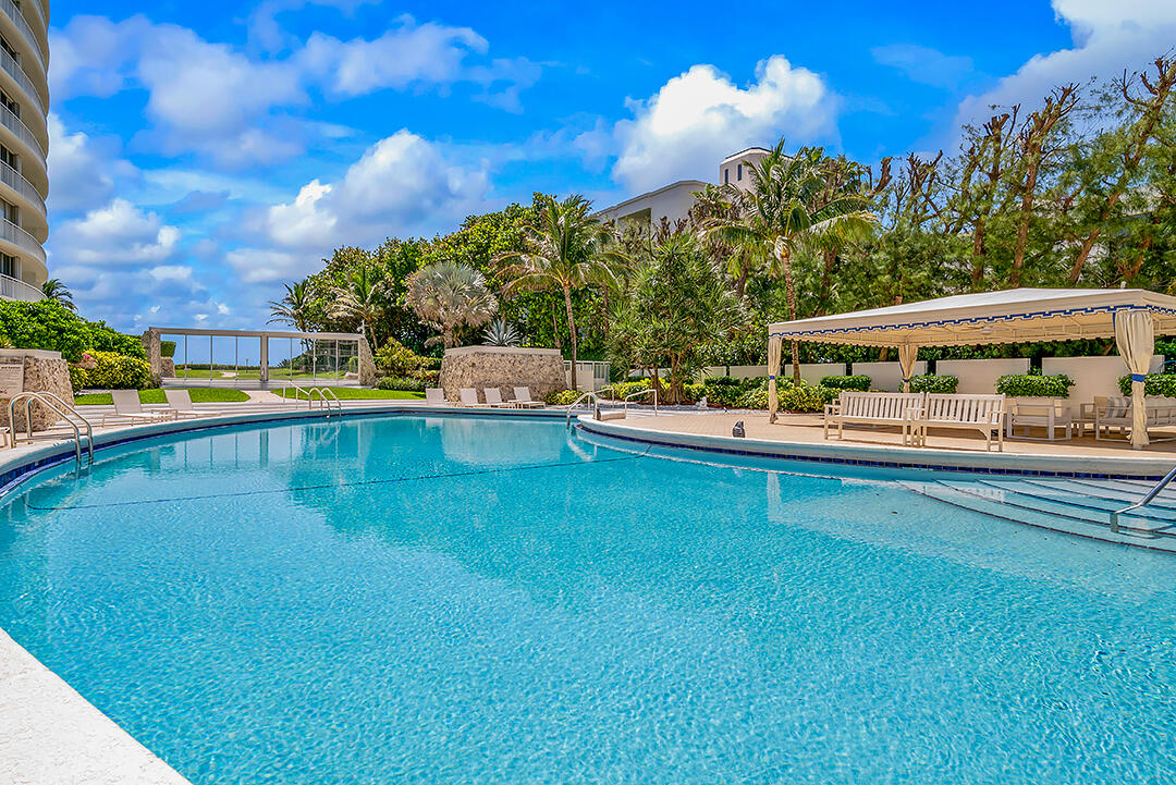 2780 South Ocean Boulevard, Unit 612 Palm Beach, FL 33480 - Photo 6 of 57 a view of a swimming pool with a patio