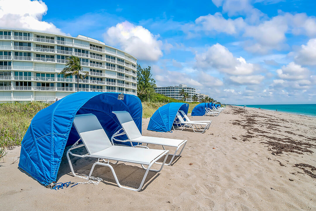 2780 South Ocean Boulevard, Unit 612 Palm Beach, FL 33480 - Photo 10 of 57 a view of a swimming pool with a lounge chairs