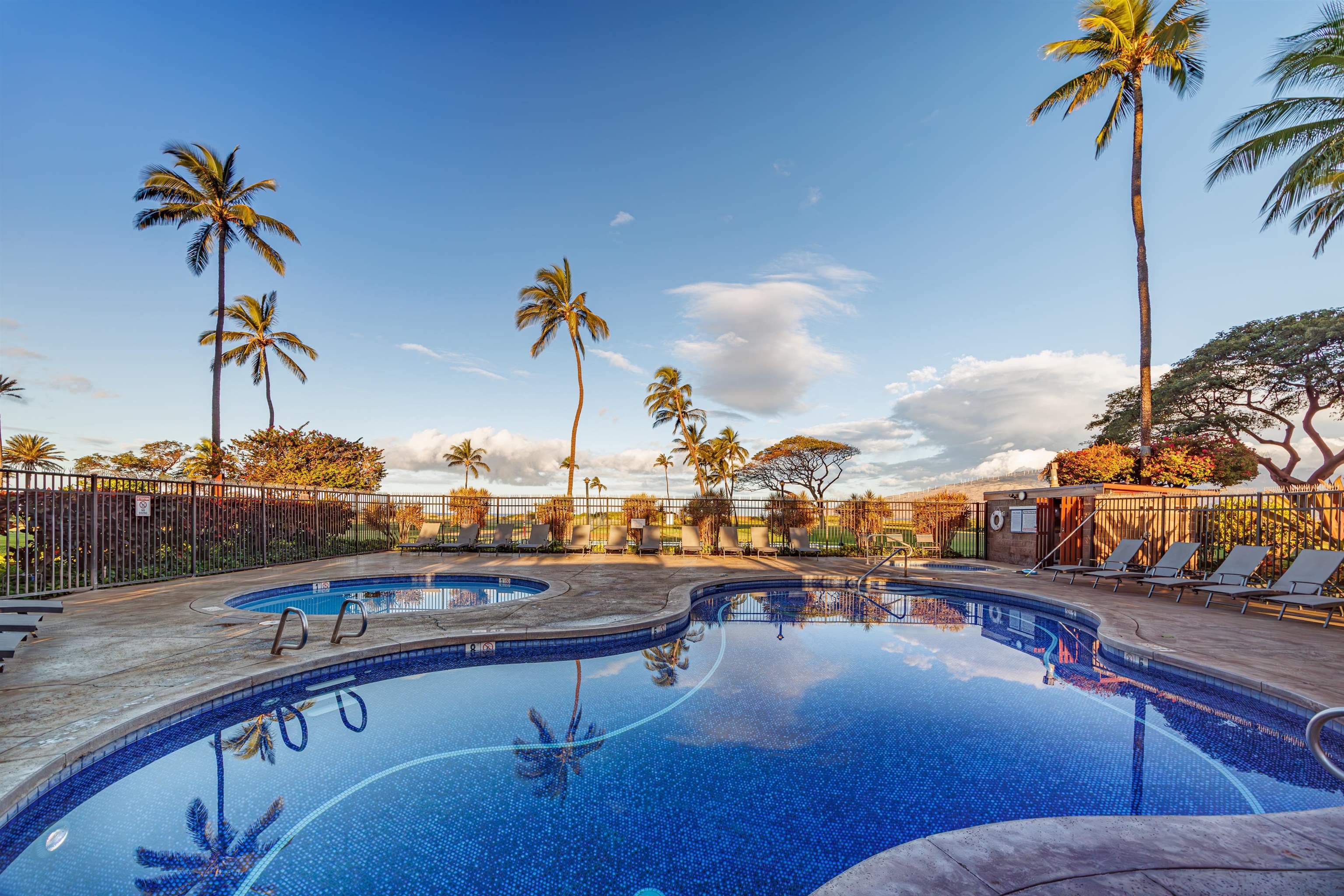 938 South Kihei Road, Unit 533 Kihei, HI 96753 - Photo 16 of 27 a view of a swimming pool with a table and chairs