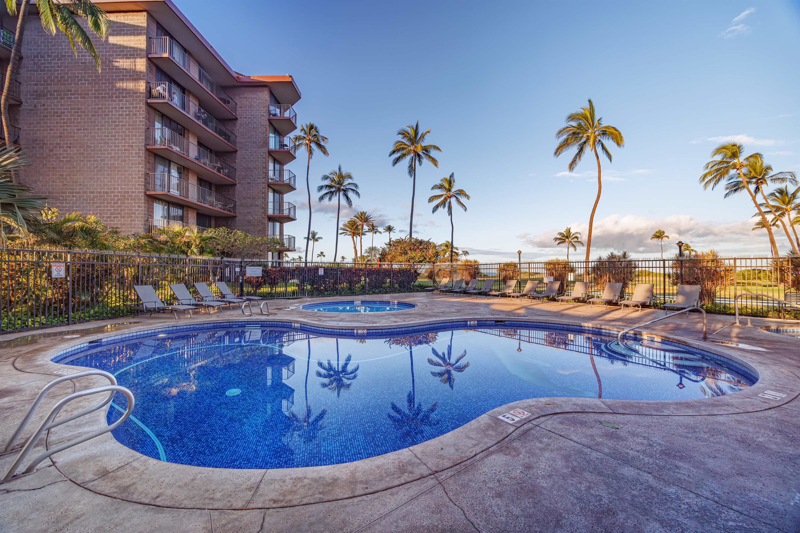 938 South Kihei Road, Unit 533 Kihei, HI 96753 - Photo 17 of 27 a view of a swimming pool with a lounge chairs