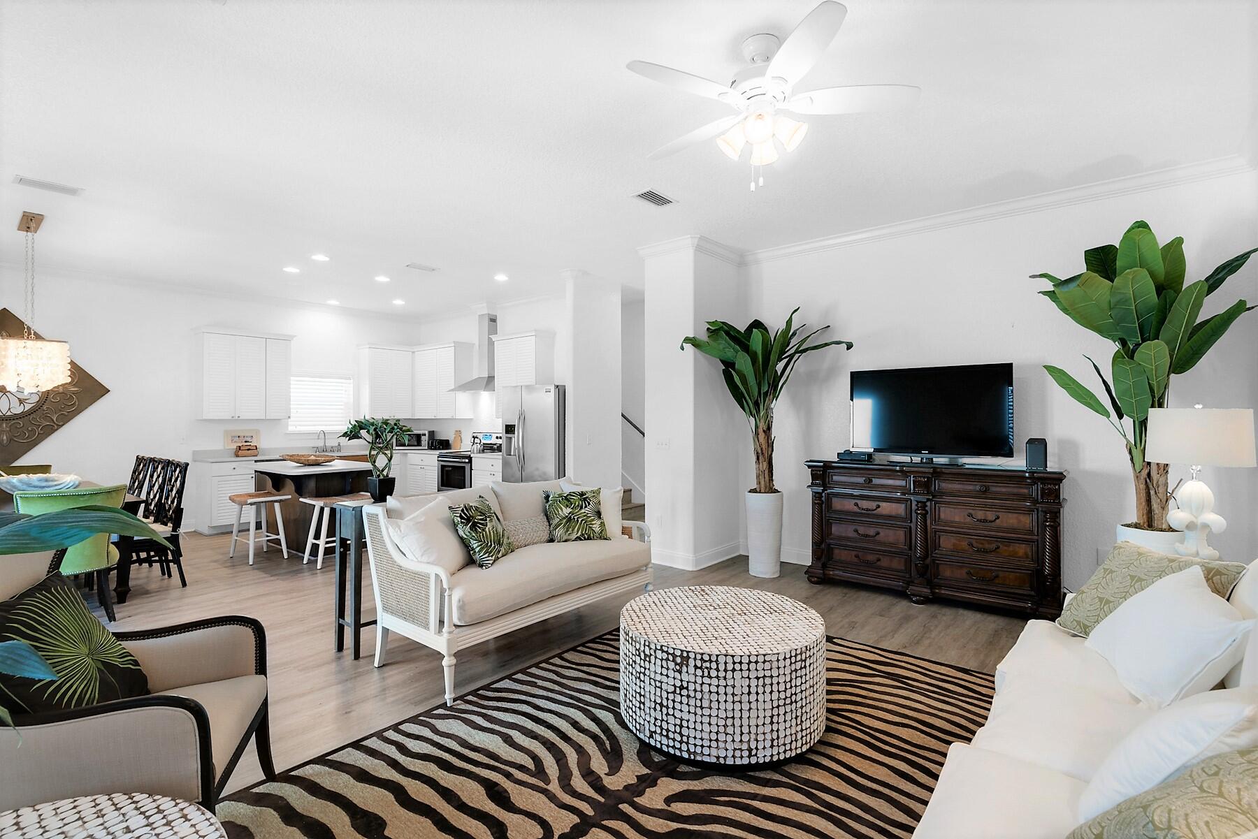 80 Pompano Street Destin, FL 32541 - Photo 14 of 71 a living room with furniture fireplace and a potted plant
