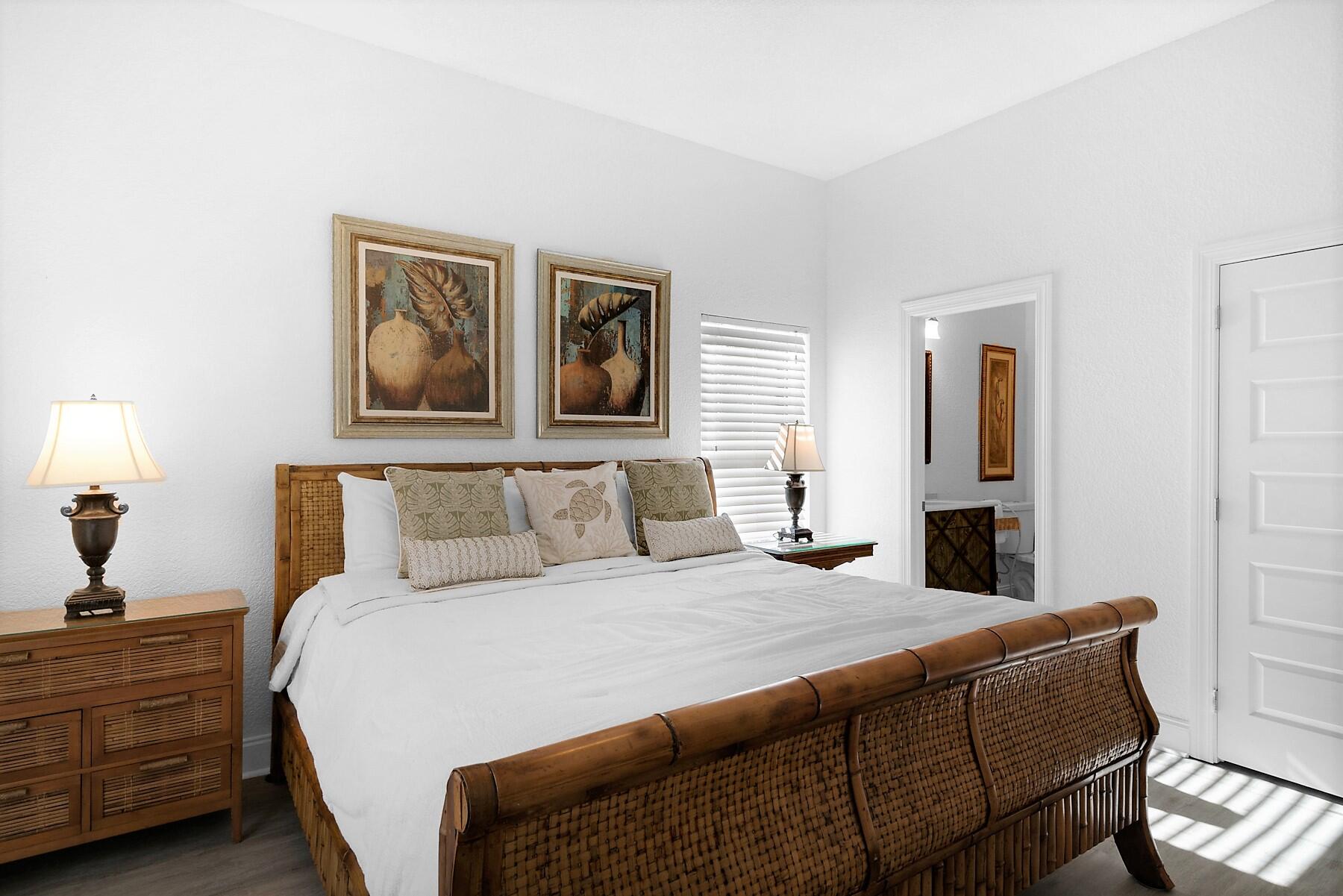 80 Pompano Street Destin, FL 32541 - Photo 22 of 71 a bedroom with a bed and a painting on the wall