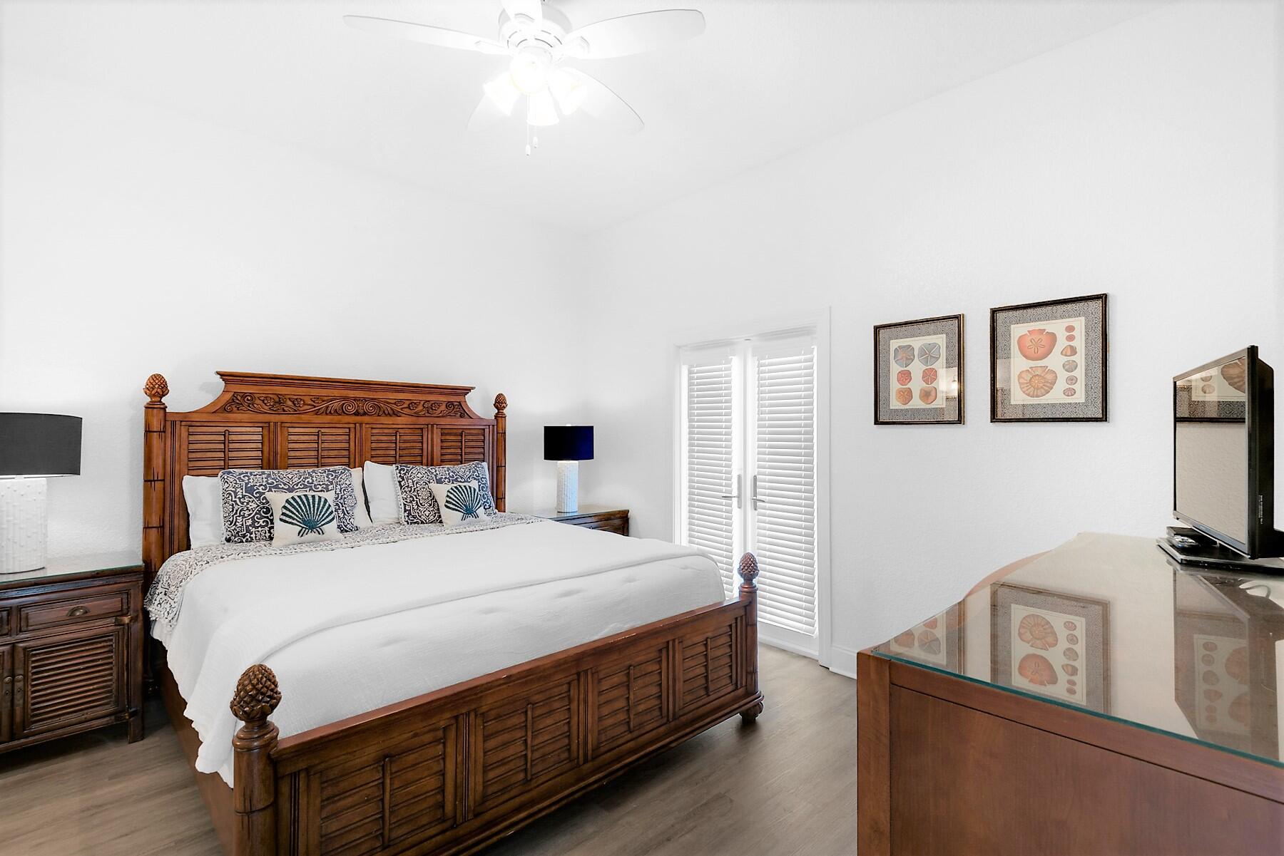 80 Pompano Street Destin, FL 32541 - Photo 24 of 71 a bedroom with a bed and a flat screen tv