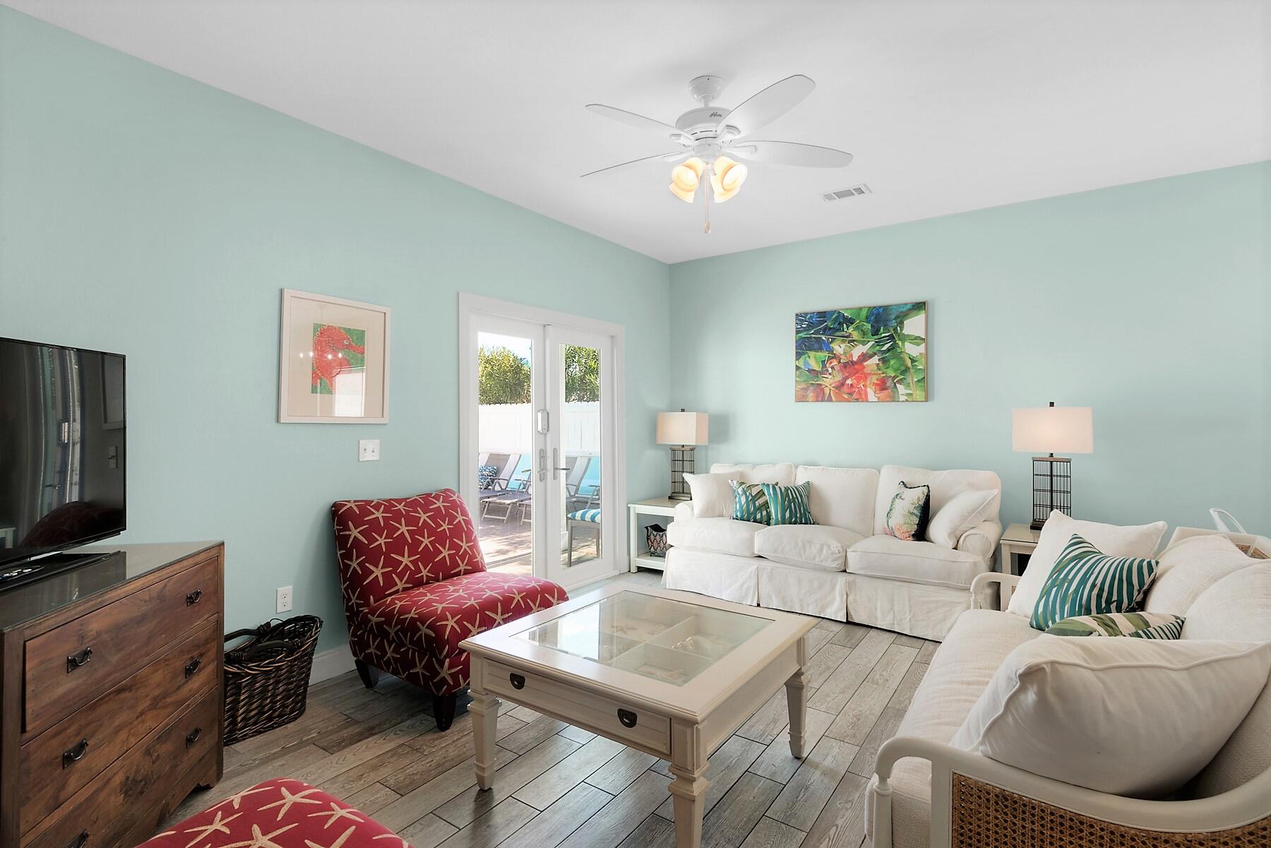 80 Pompano Street Destin, FL 32541 - Photo 47 of 71 a living room with furniture and a flat screen tv