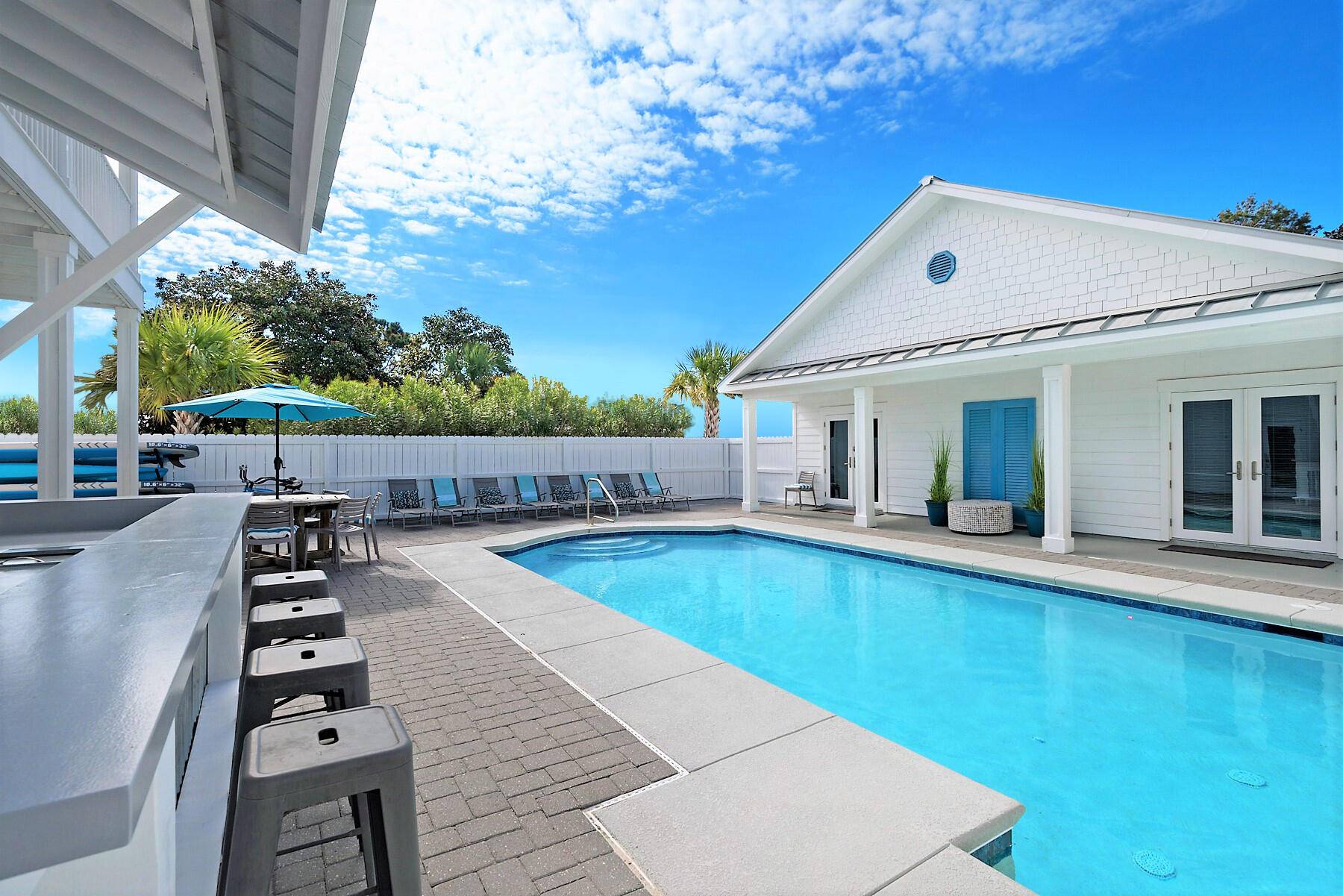 80 Pompano Street Destin, FL 32541 - Photo 10 of 71 a view of a patio with chairs and potted plants