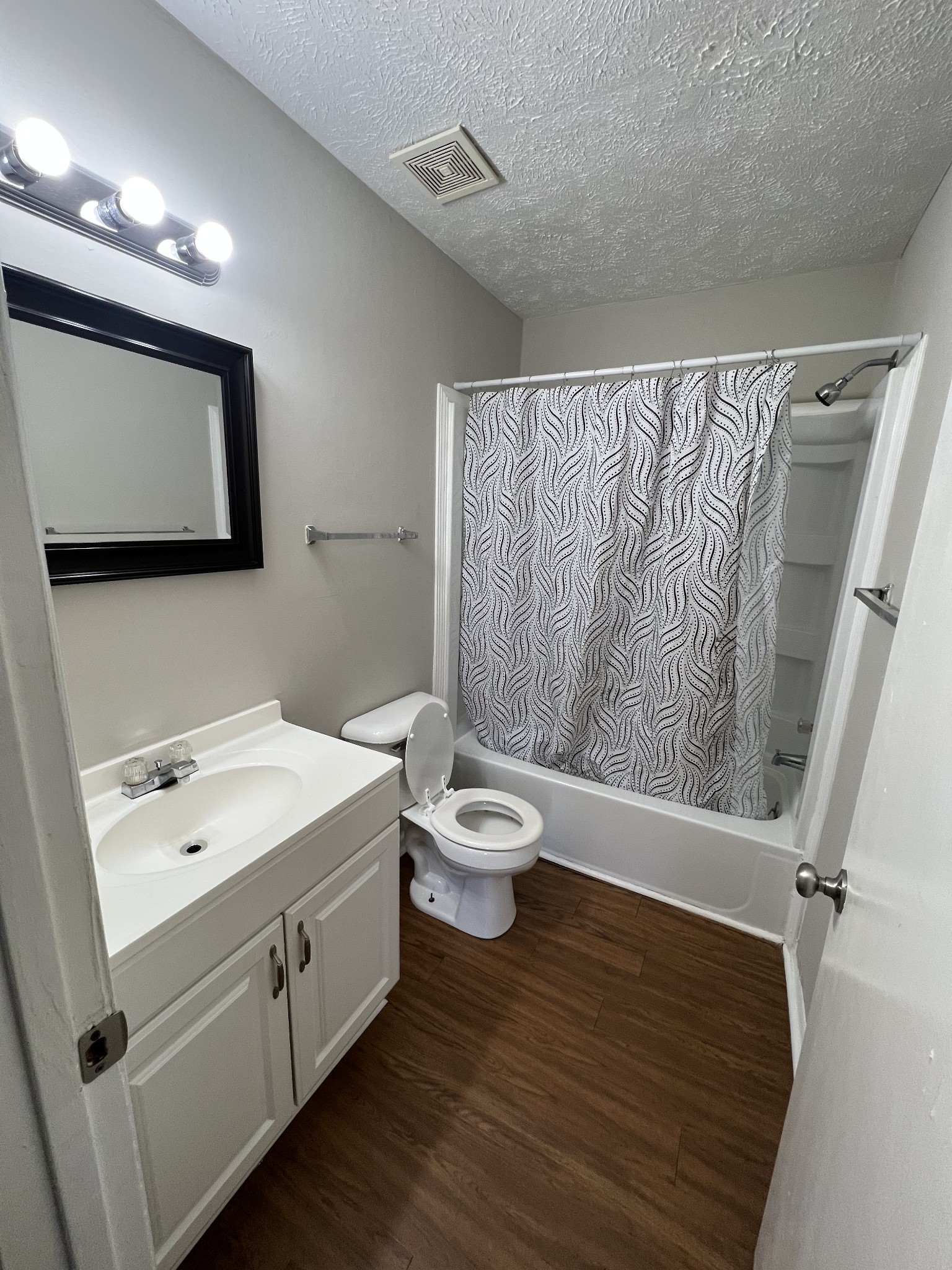 209 East Webster Street Madison, TN 37115 - Photo 11 of 33 a bathroom with a toilet sink and mirror