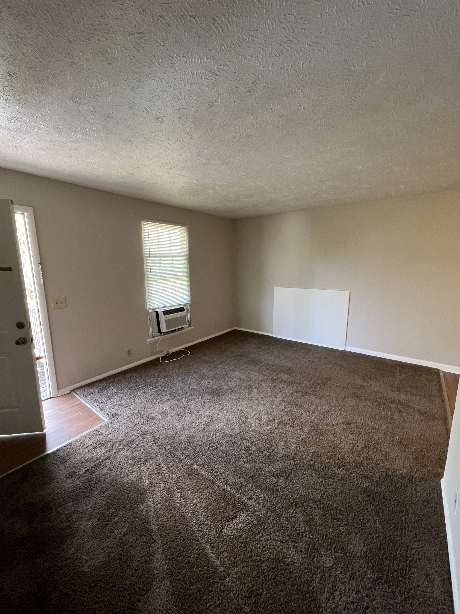 209 East Webster Street Madison, TN 37115 - Photo 12 of 33 an empty room with a empty space and windows