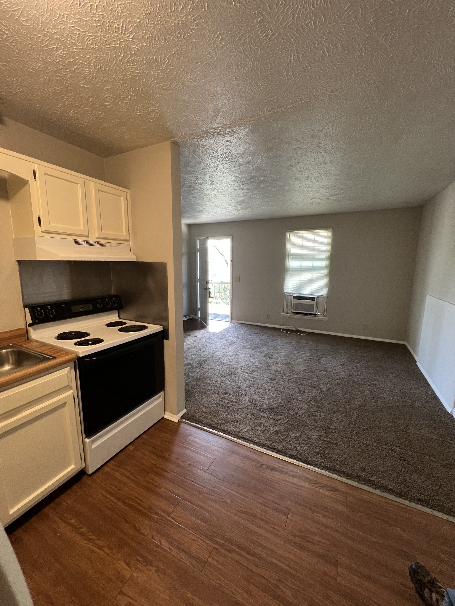 209 East Webster Street Madison, TN 37115 - Photo 19 of 33 a large kitchen with kitchen island granite countertop a stove and a refrigerator