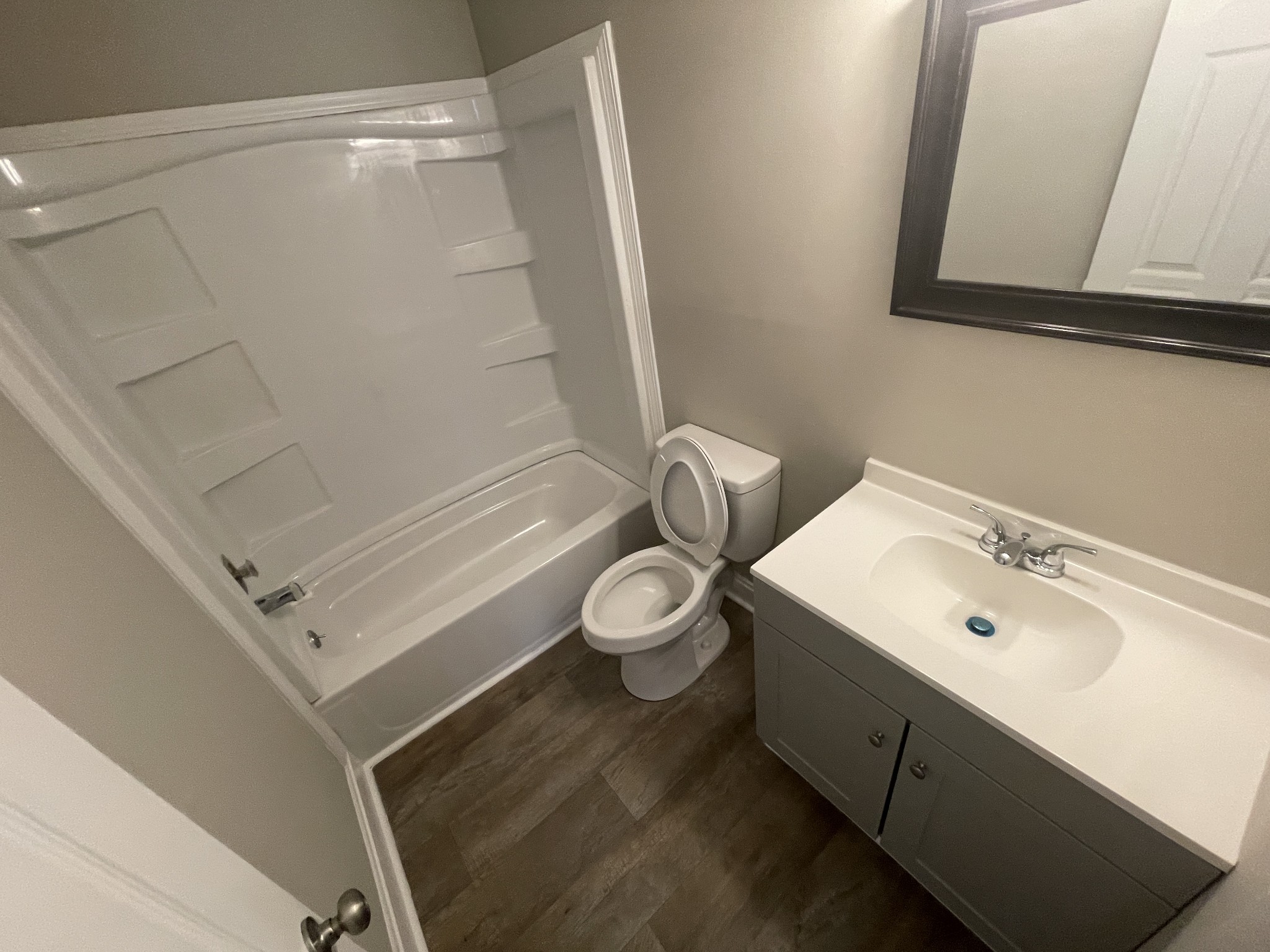 209 East Webster Street Madison, TN 37115 - Photo 2 of 33 a bathroom with a toilet sink and mirror