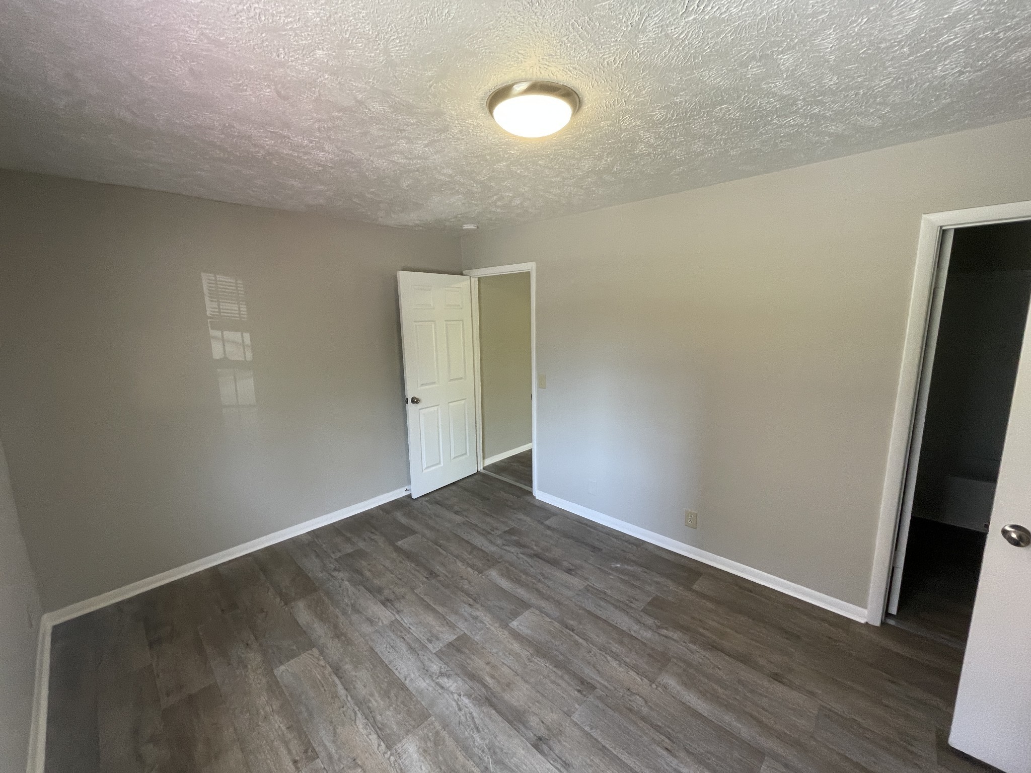 209 East Webster Street Madison, TN 37115 - Photo 3 of 33 a view of an empty room with wooden floor