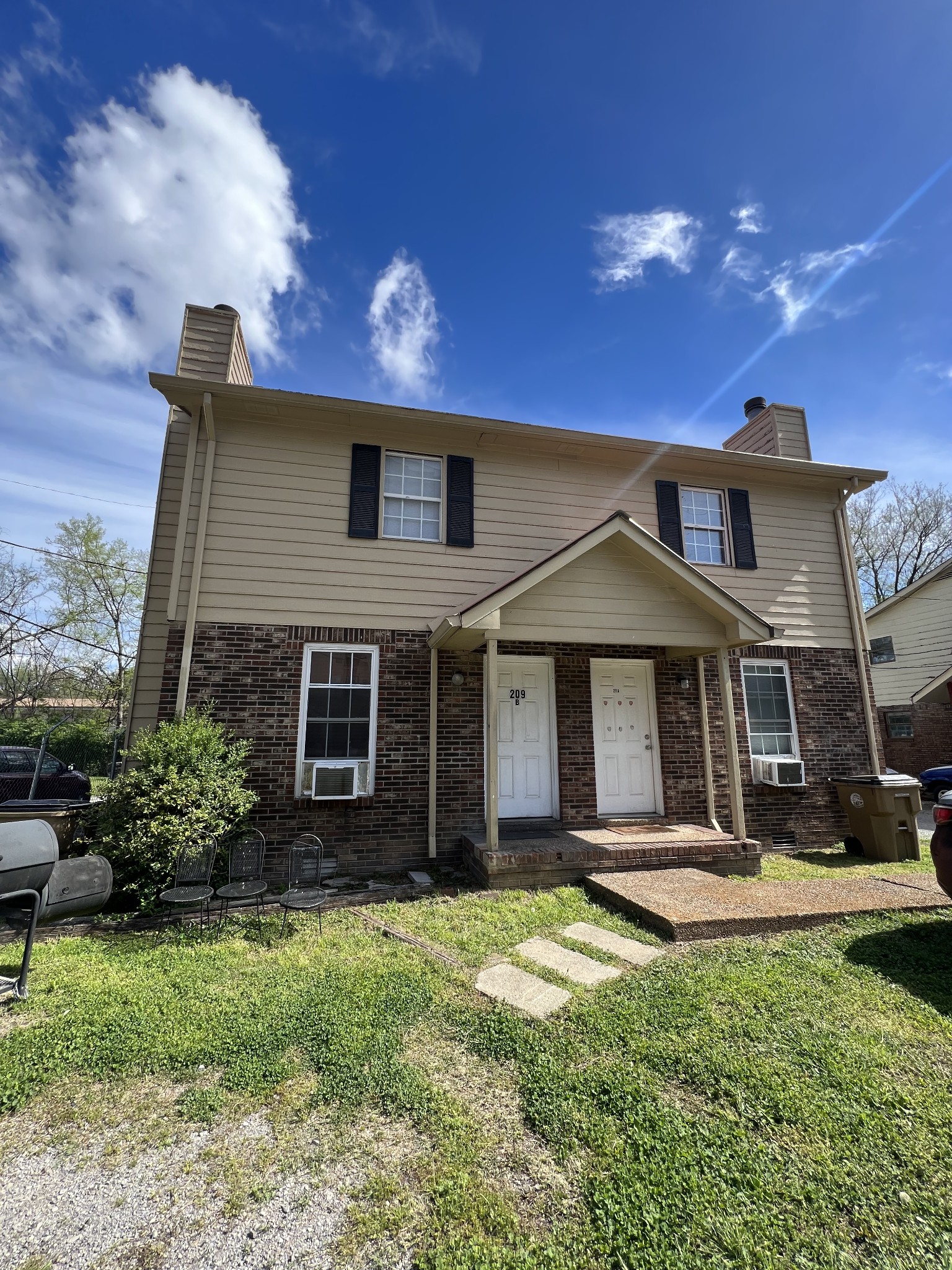 209 East Webster Street Madison, TN 37115 - Photo 7 of 33 a front view of a house with a yard