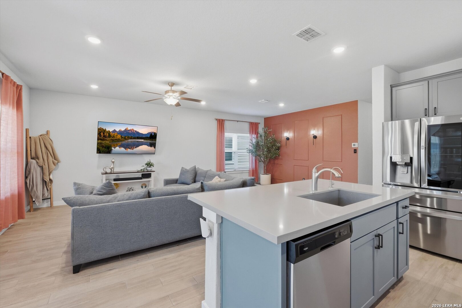 10776 Rosalina Loop Converse, TX 78109 - Photo 12 of 31 a kitchen with stainless steel appliances granite countertop a sink and a refrigerator