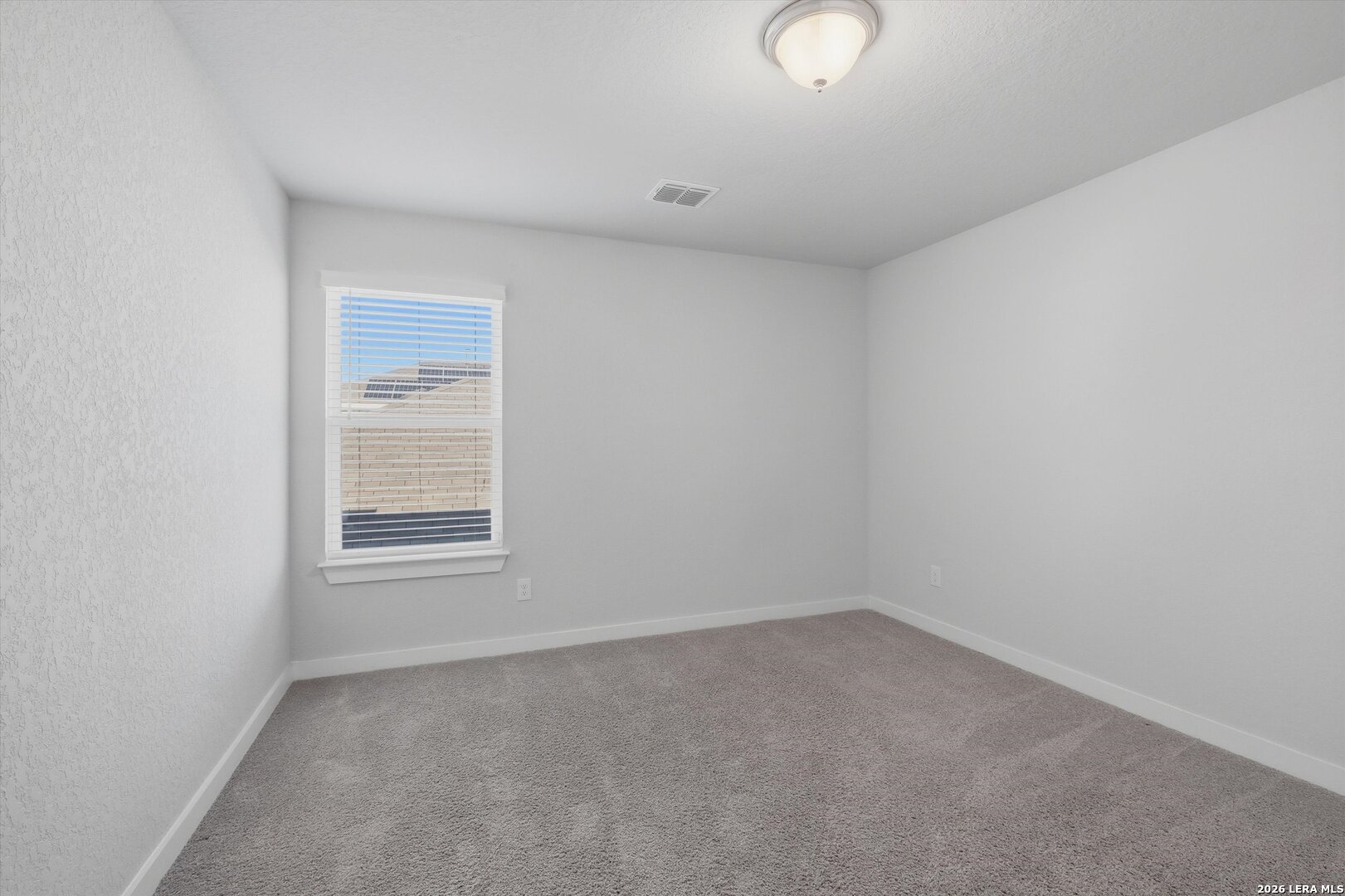 10776 Rosalina Loop Converse, TX 78109 - Photo 17 of 31 an empty room with a window