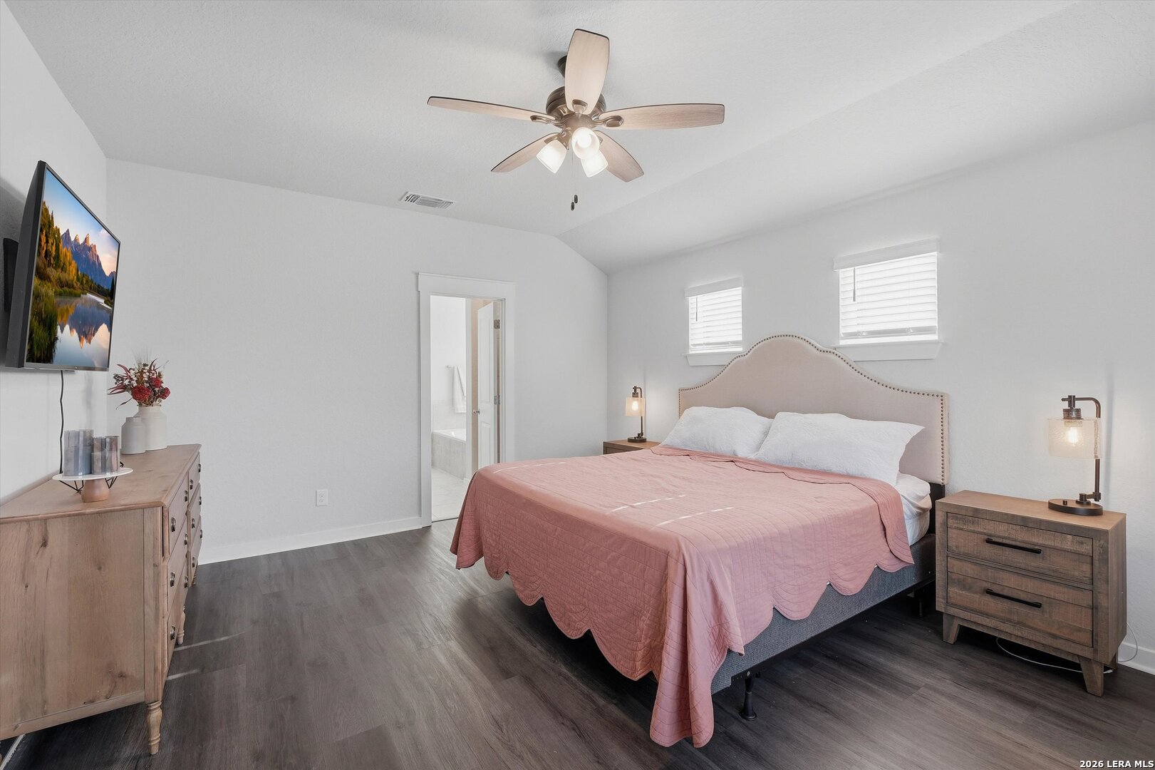 10776 Rosalina Loop Converse, TX 78109 - Photo 20 of 31 a bedroom with bed tv and wooden floor