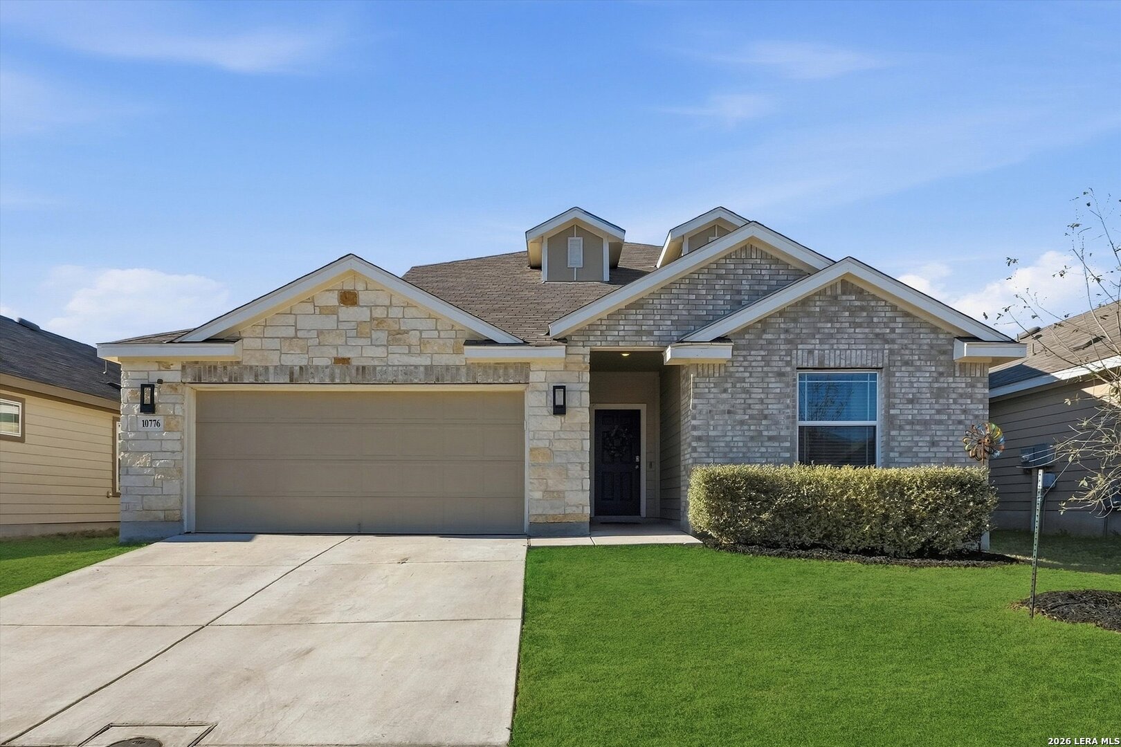 10776 Rosalina Loop Converse, TX 78109 - Photo 2 of 31 a front view of a house with a yard and garage