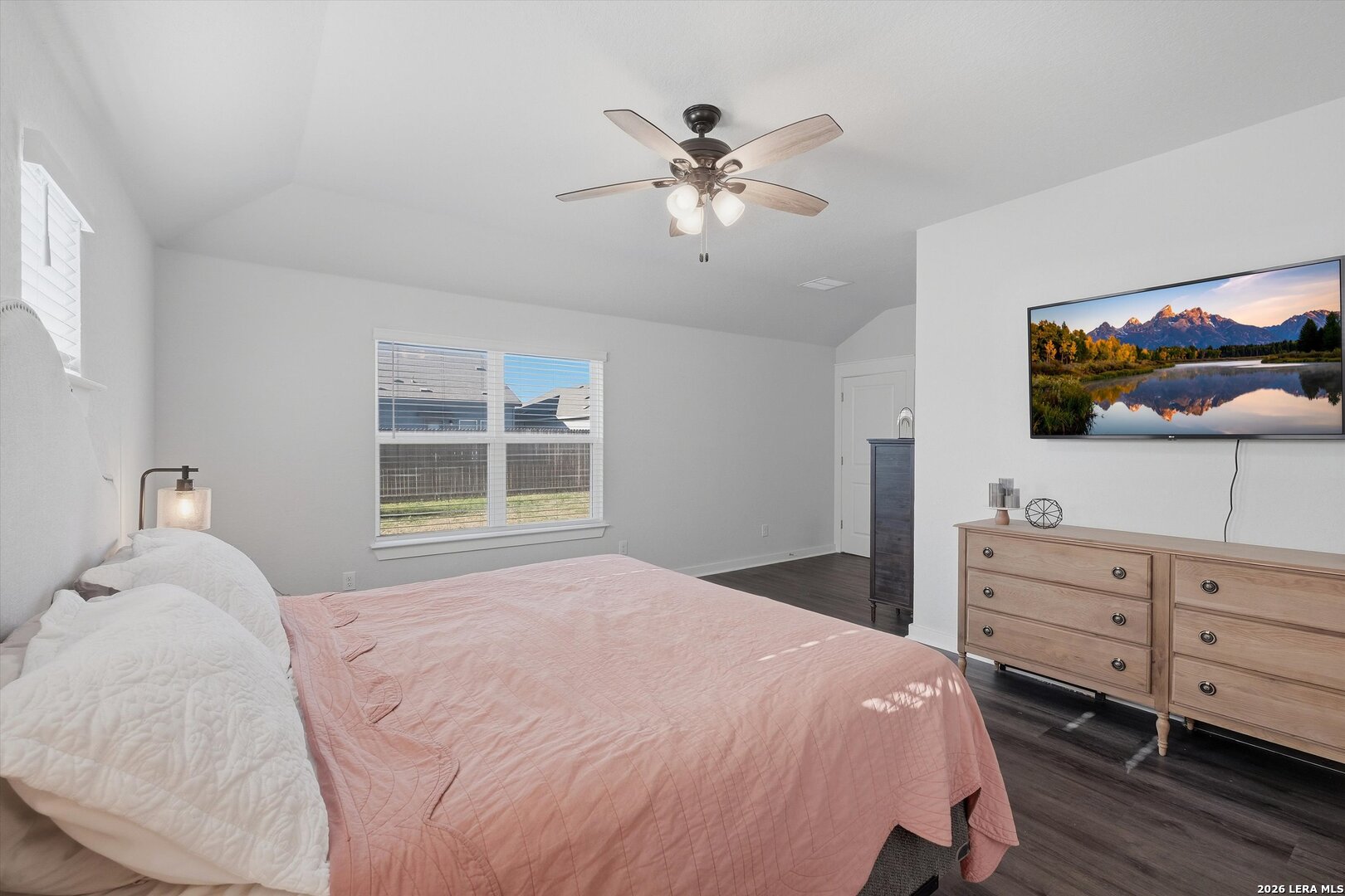 10776 Rosalina Loop Converse, TX 78109 - Photo 21 of 31 a bedroom with a large bed and a flat tv screen on dresser
