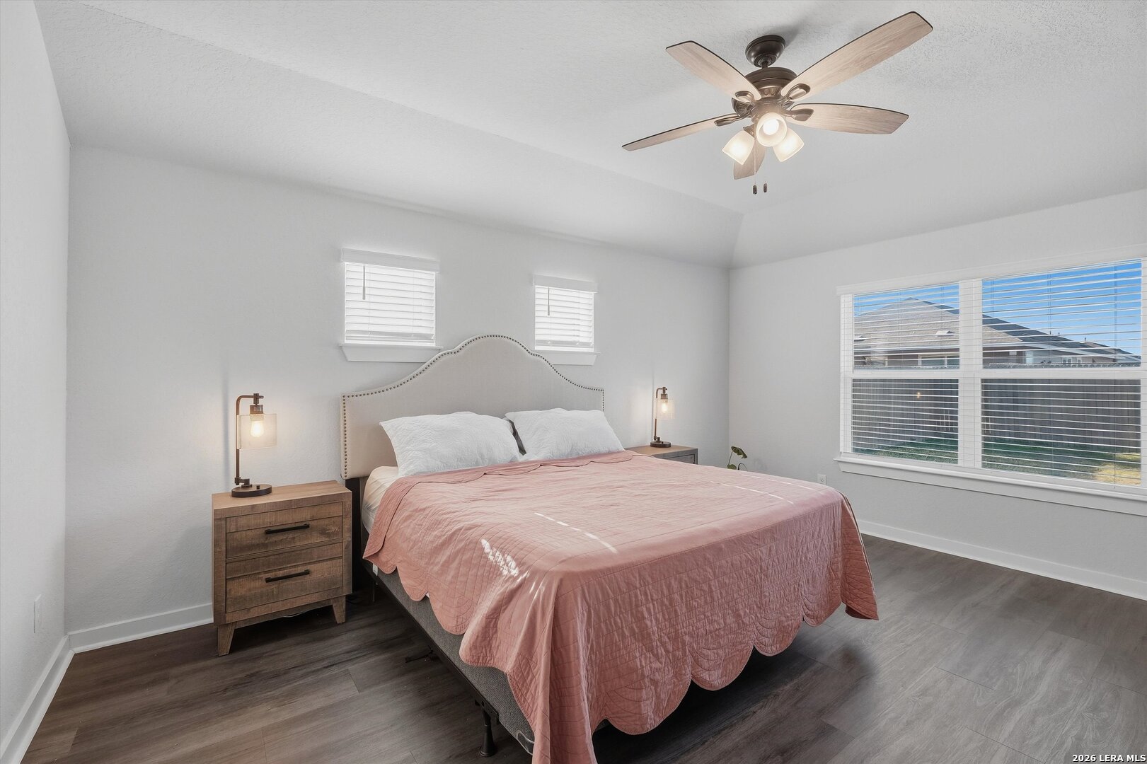 10776 Rosalina Loop Converse, TX 78109 - Photo 22 of 31 a bedroom with a large bed and a large window