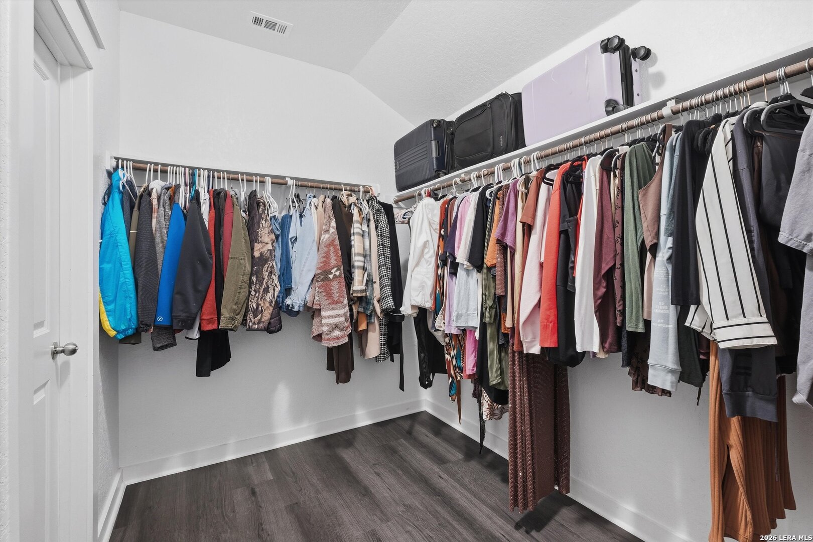 10776 Rosalina Loop Converse, TX 78109 - Photo 23 of 31 a view of walk in closet with clothes and shoes