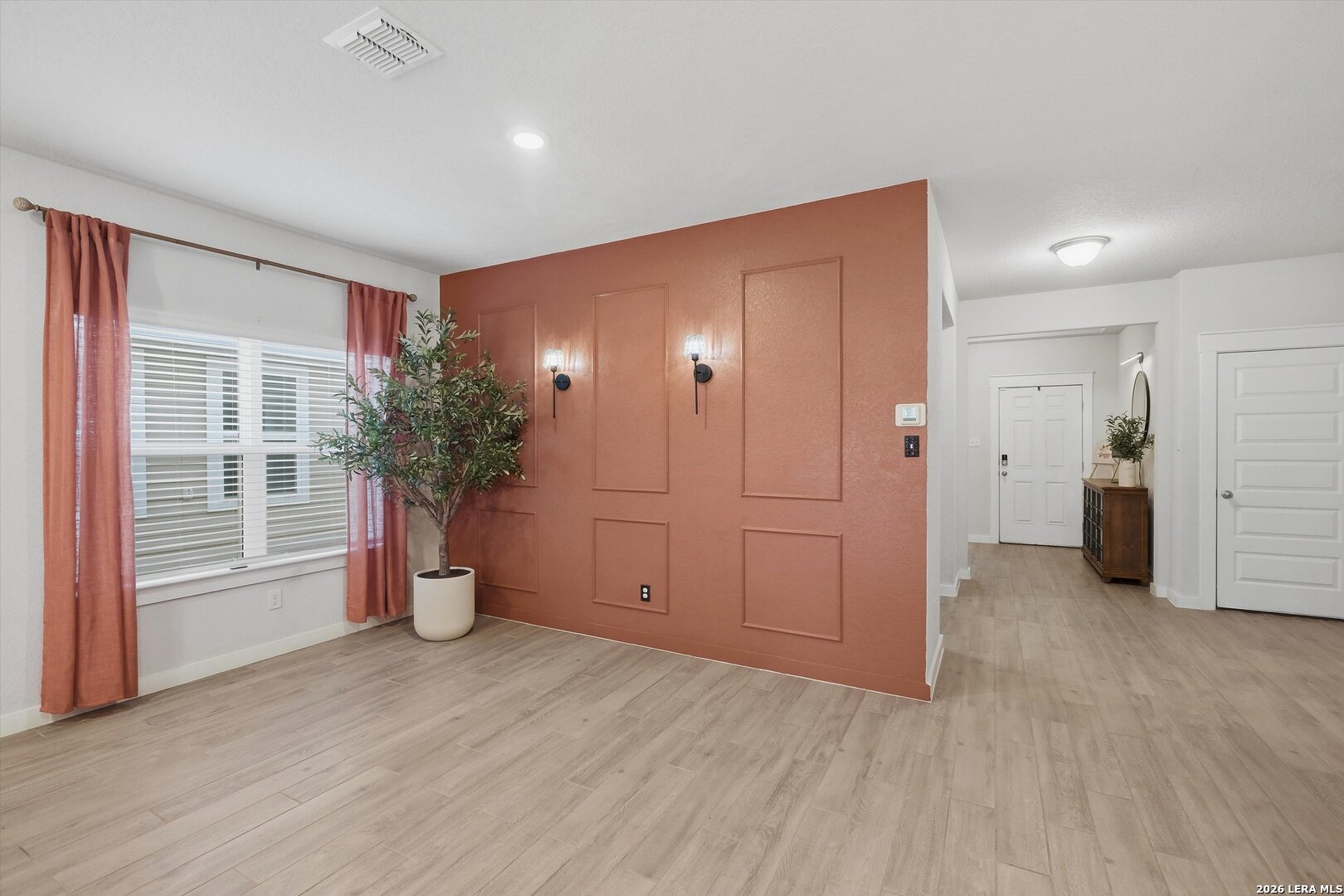 10776 Rosalina Loop Converse, TX 78109 - Photo 4 of 31 wooden floor in an empty room with a window
