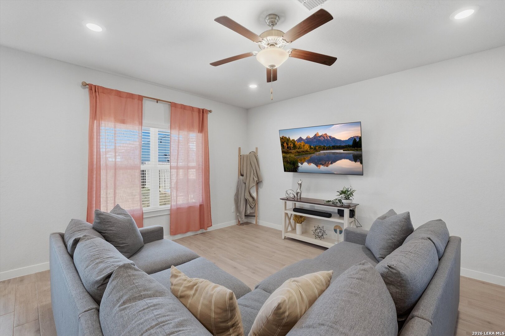 10776 Rosalina Loop Converse, TX 78109 - Photo 6 of 31 a bedroom with a bed and a flat screen tv