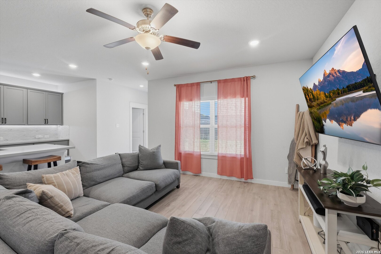 10776 Rosalina Loop Converse, TX 78109 - Photo 7 of 31 a living room with furniture and a flat screen tv